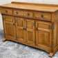 A WOOD BROTHERS OLD CHARM VINTAGE CARVED OAK SIDEBOARD / DRESSER BASE.