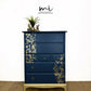 Refinished Stag Minstrel Tallboy Chest Of Drawers In Navy Blue With Gold Foil Floral Bird Design