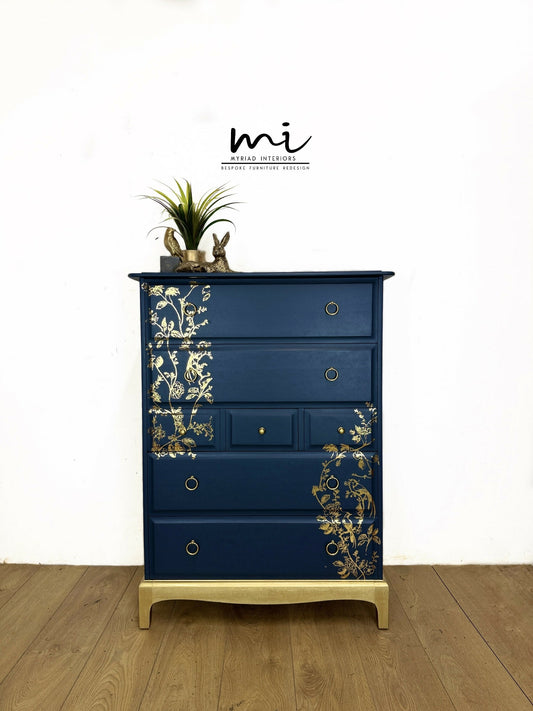 Refinished Stag Minstrel Tallboy Chest Of Drawers In Navy Blue With Gold Foil Floral Bird Design