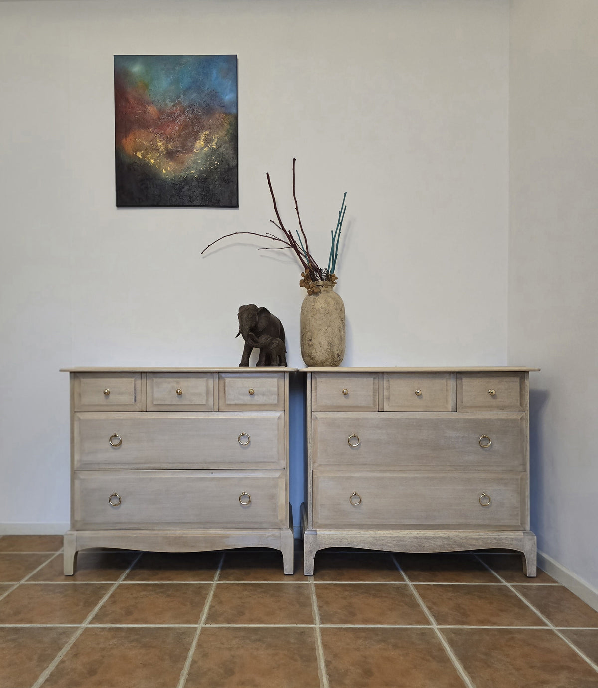 Pair Stag minstrel chest of drawers