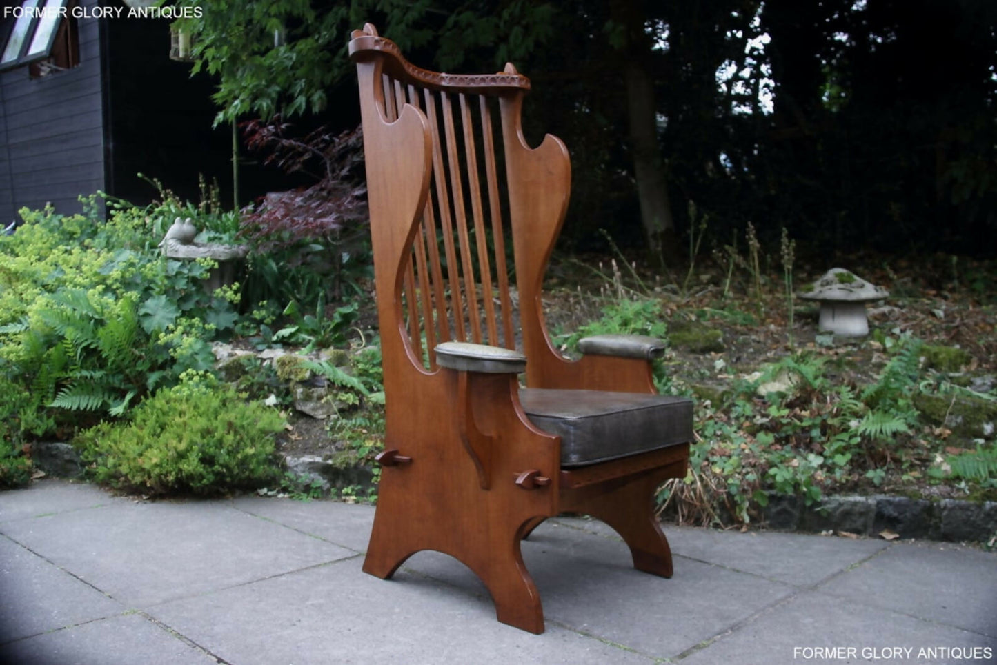 A RUPERT / NIGEL GRIFFITHS CARVED OAK DERBYSHIRE WING BACK LEATHER / ARMCHAIR