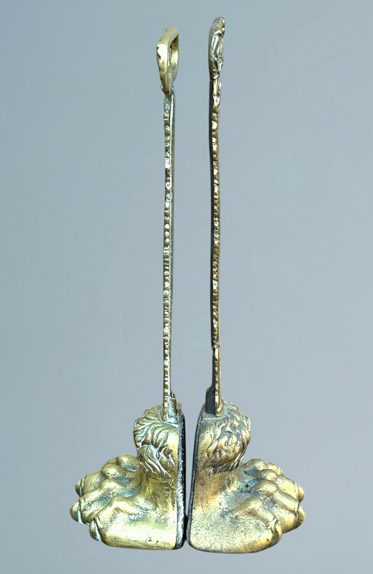 A Near Pair of 19th Century Brass Lion Paw Door Porters