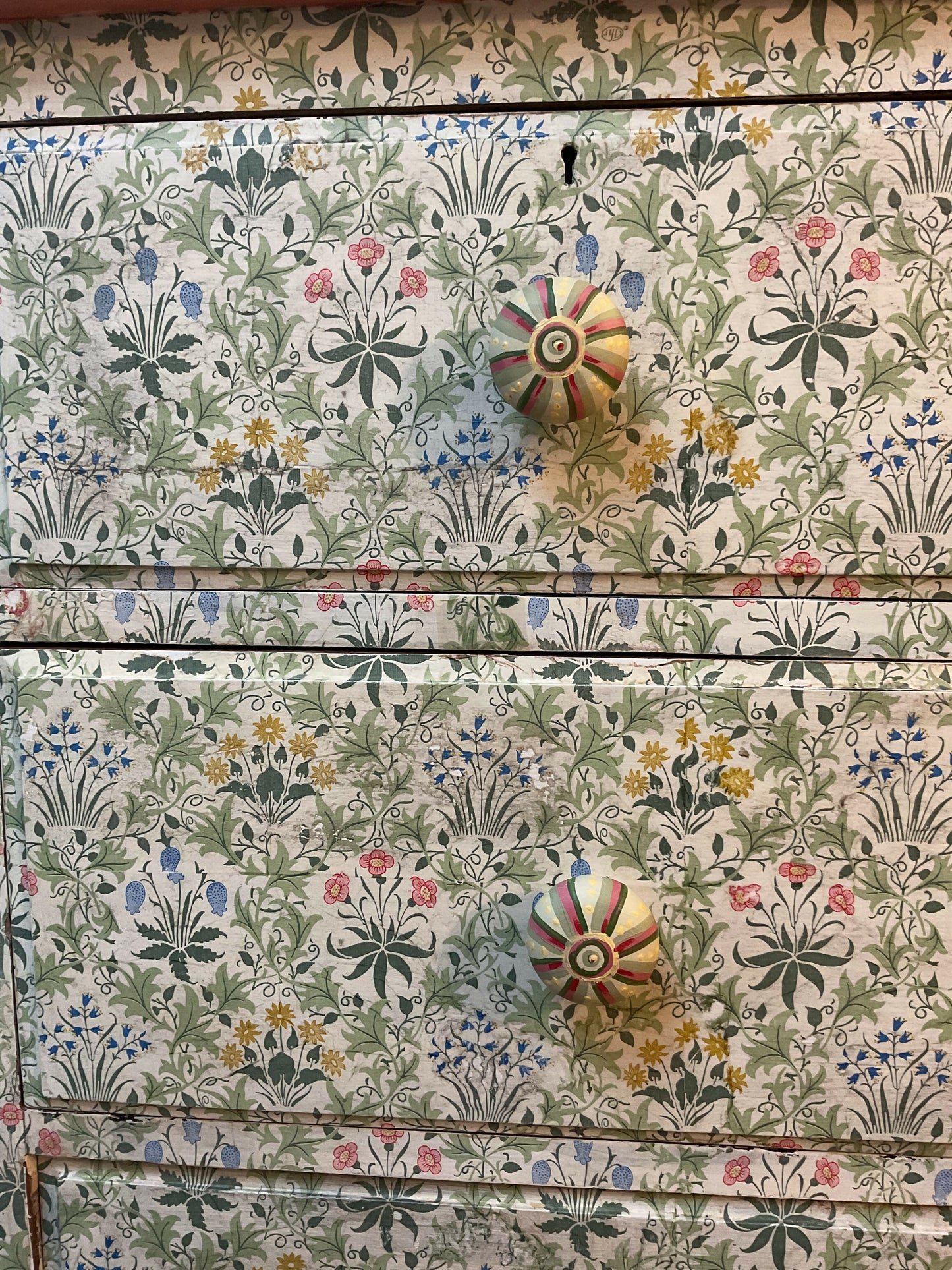 Antique chest of drawers covered in William Morris decoupage. With hand painted handles.
