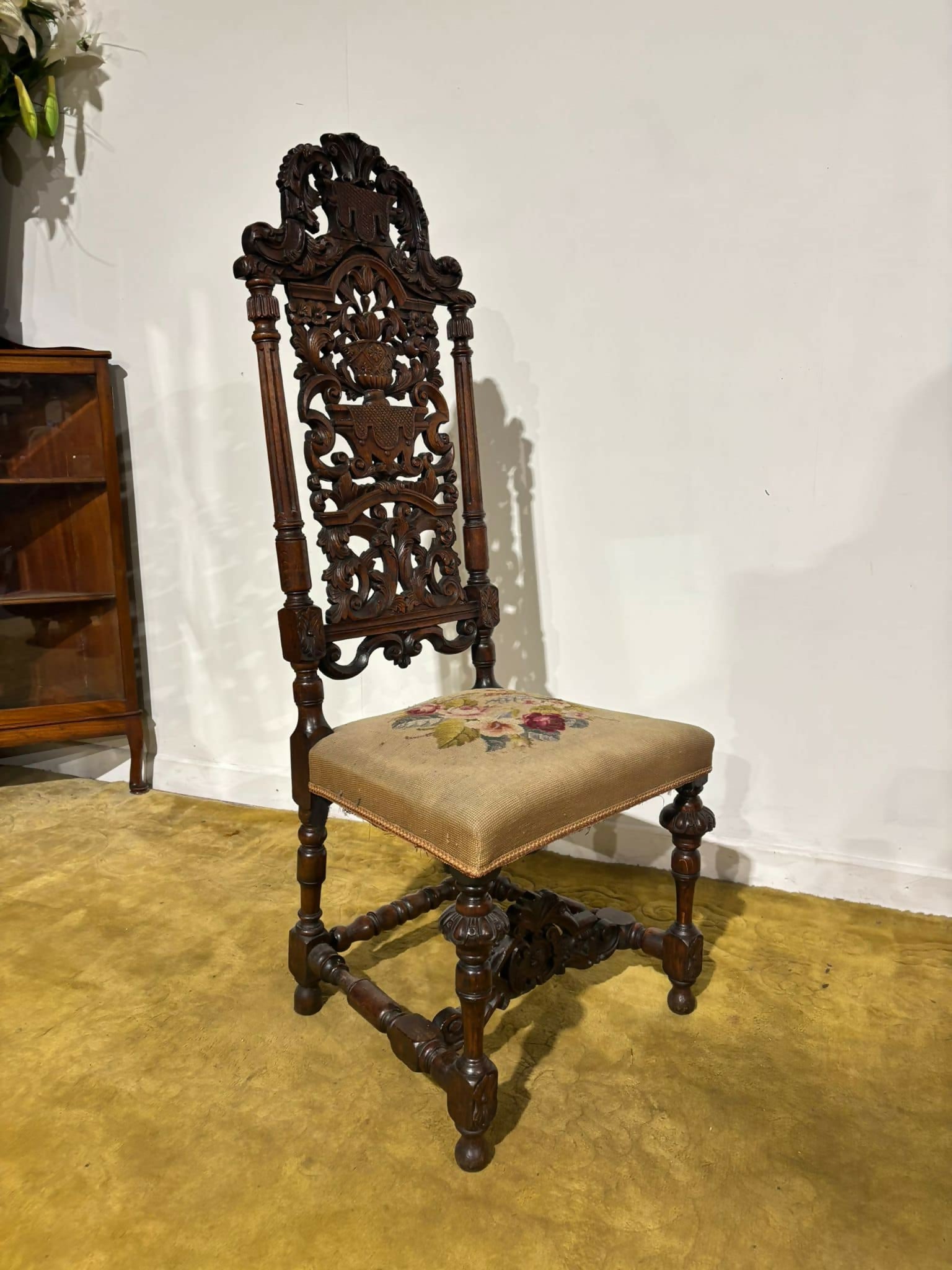 Carolean carved oak high back chair - having a very decoratively carved back, legs44