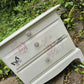 Stag Minstrel beside cabinet with 2 drawers & pullout tray painted in clotted cream