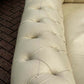 Vintage Victorian Buttoned Back Chesterfield Sofa In Leather On Brass Castors.