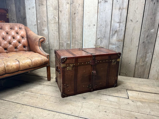 Antique leather trimmed chestnut brown campaign chest