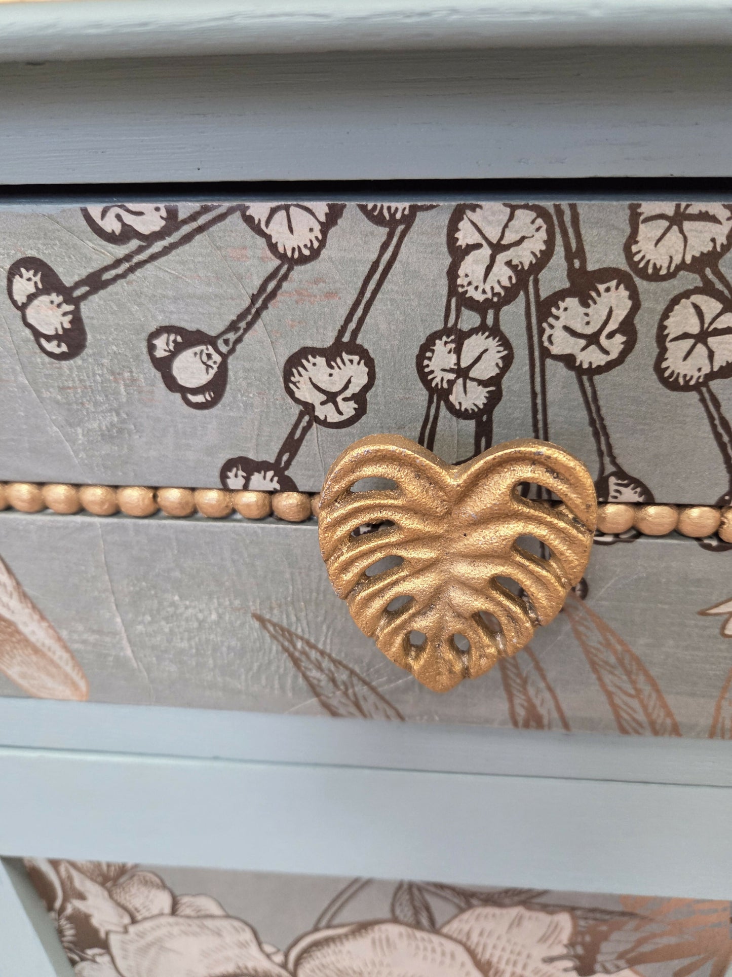 Vintage pale blue and gold drawered cupboard.