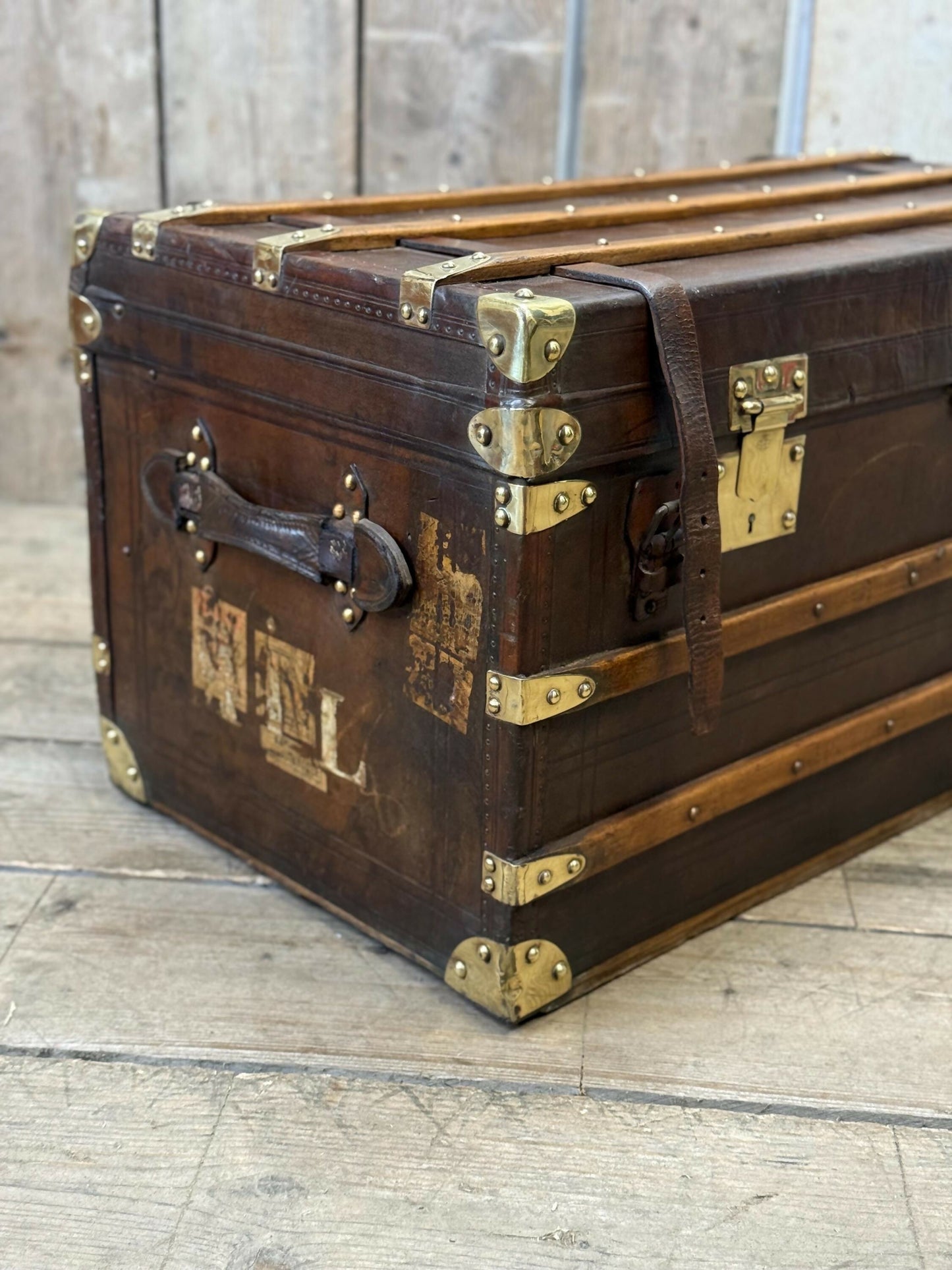 Antique full leather and brass bound travel trunk coffee table