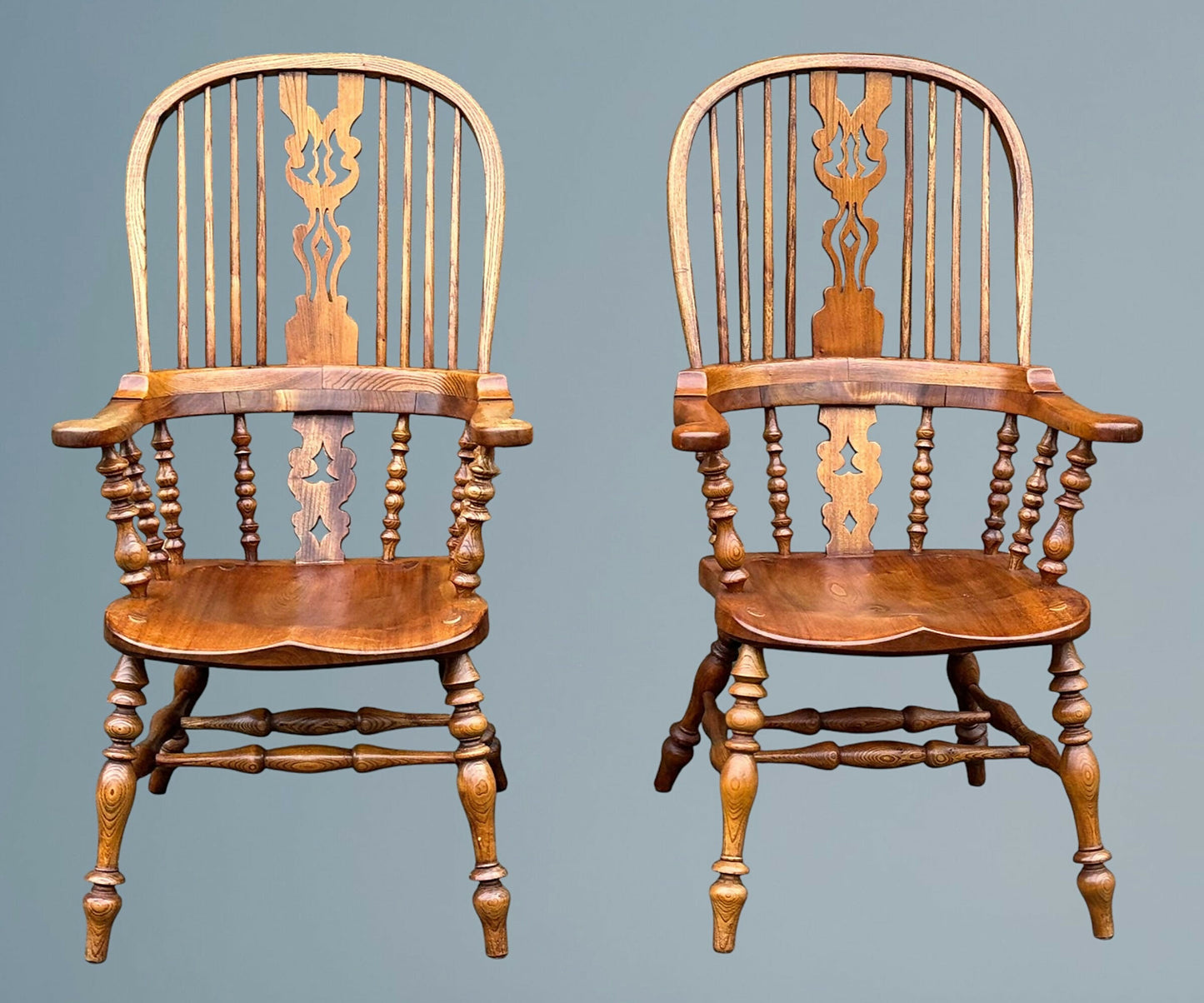 A Large Pair of Ash Broad Arm Windsor Chairs