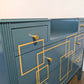 Blue and gold chest of drawers with geometric pattern and original mirrors