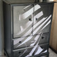 Stag Linen Press | Jet Black Gloss Cabinet with Striking Femme Artwork & Dramatic Yellow Interior