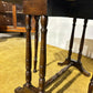 Edwardian mahogany table of small proportions resting on turned legs.0