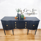 Black serpentine sideboard