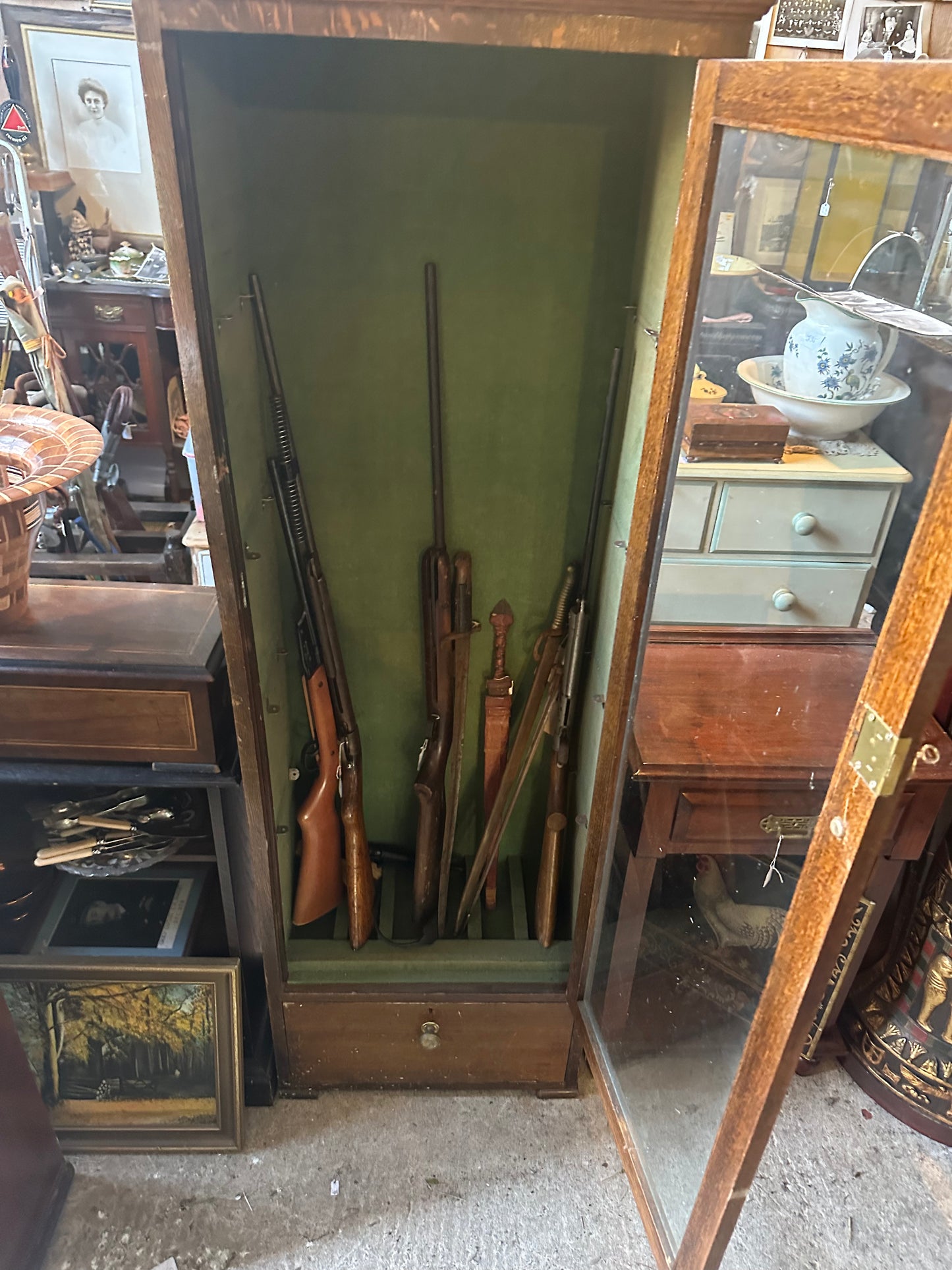 Tall Antique Gun Display Cabinet