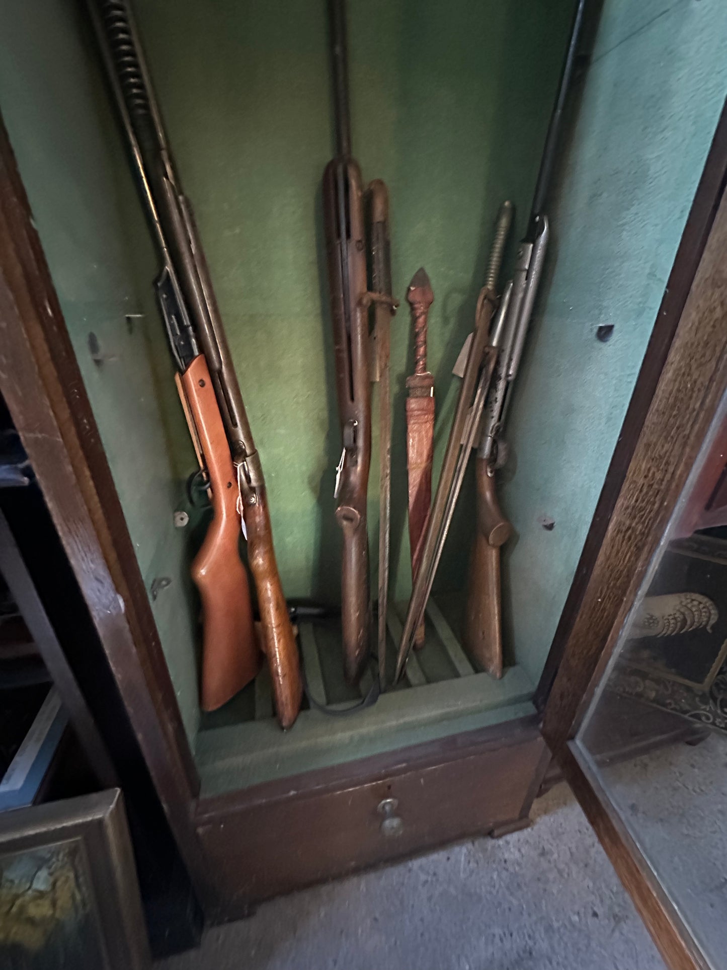 Tall Antique Gun Display Cabinet