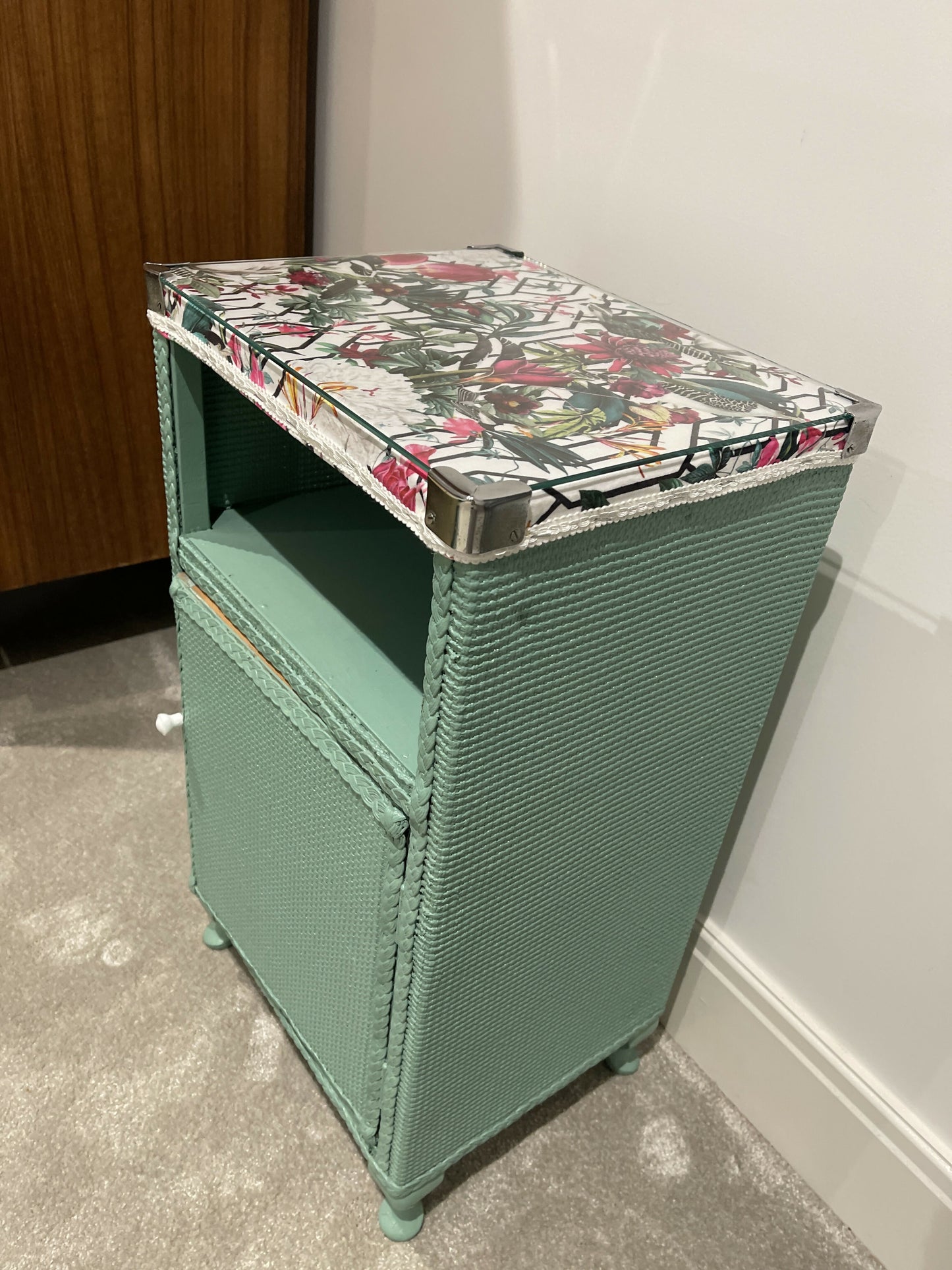 Green painted glass topped cabinet. Beautiful fabric accent top.