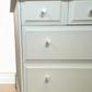 Stag Minstrel Chest of Drawers on Grey, Oversize bedside table