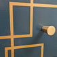 Blue and gold chest of drawers with geometric pattern and original mirrors