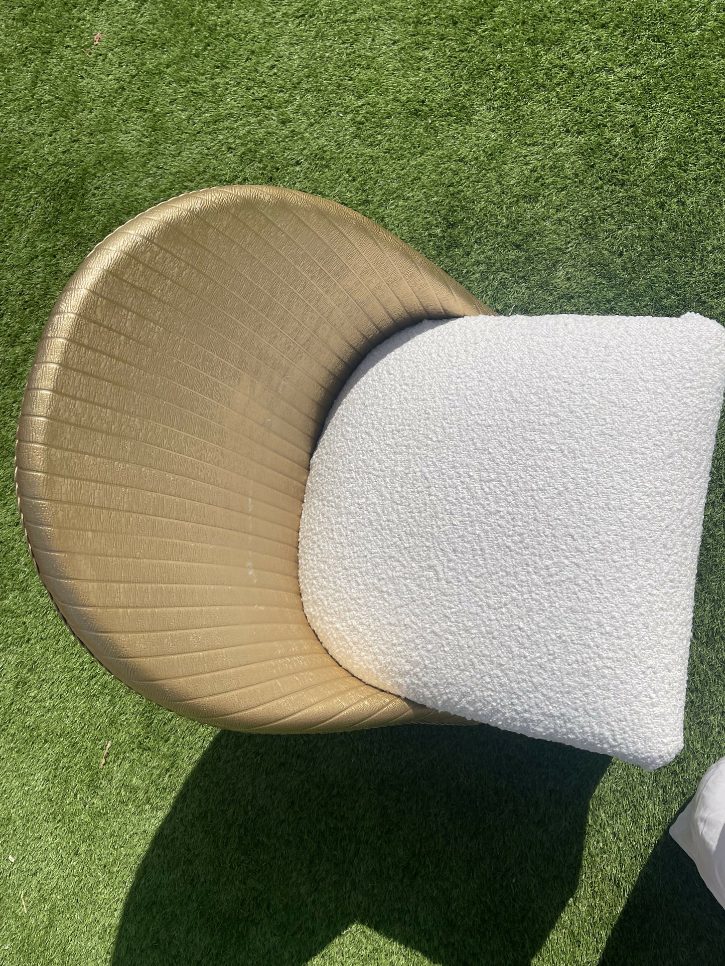 Gold wipe clean accent chair with luxurious white boucle fabric and some sneaky storage