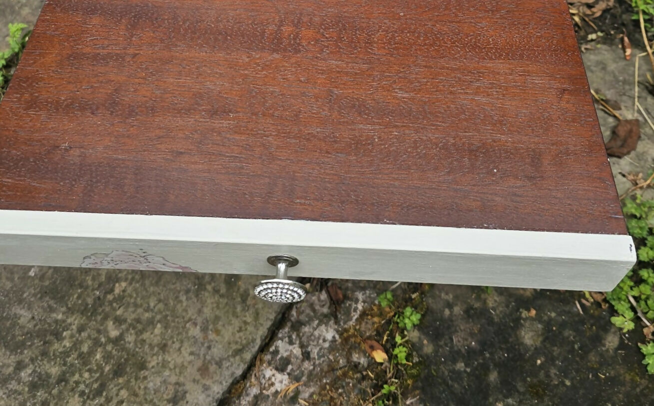 Stag Minstrel beside cabinet with 2 drawers & pullout tray painted in clotted cream