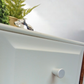 Stag Minstrel Chest of Drawers on Grey, Oversize bedside table