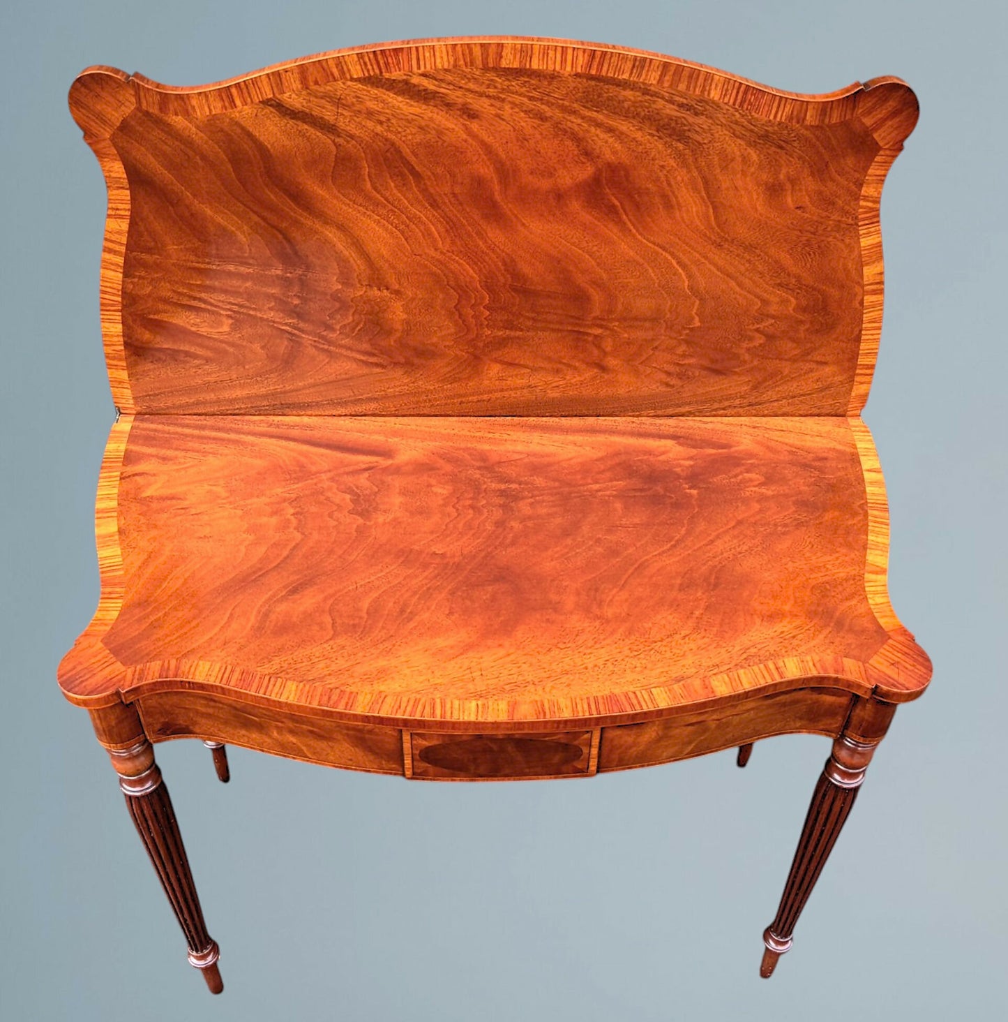 A Mahogany Serpentine Fronted Turn Over Top Tea Table