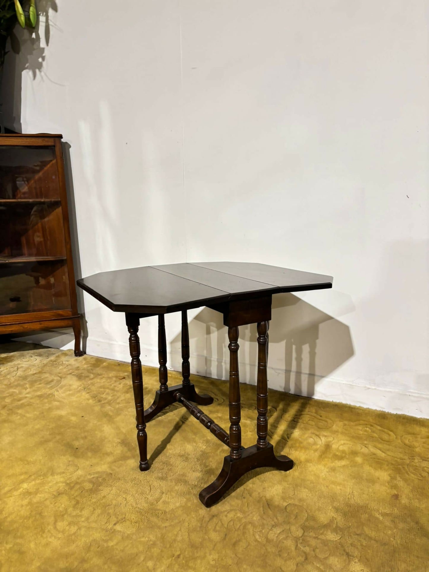 Edwardian mahogany table of small proportions resting on turned legs.3