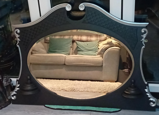 A beautifully restored vintage 1950s over-mantle mirror with striking ornamental detail.