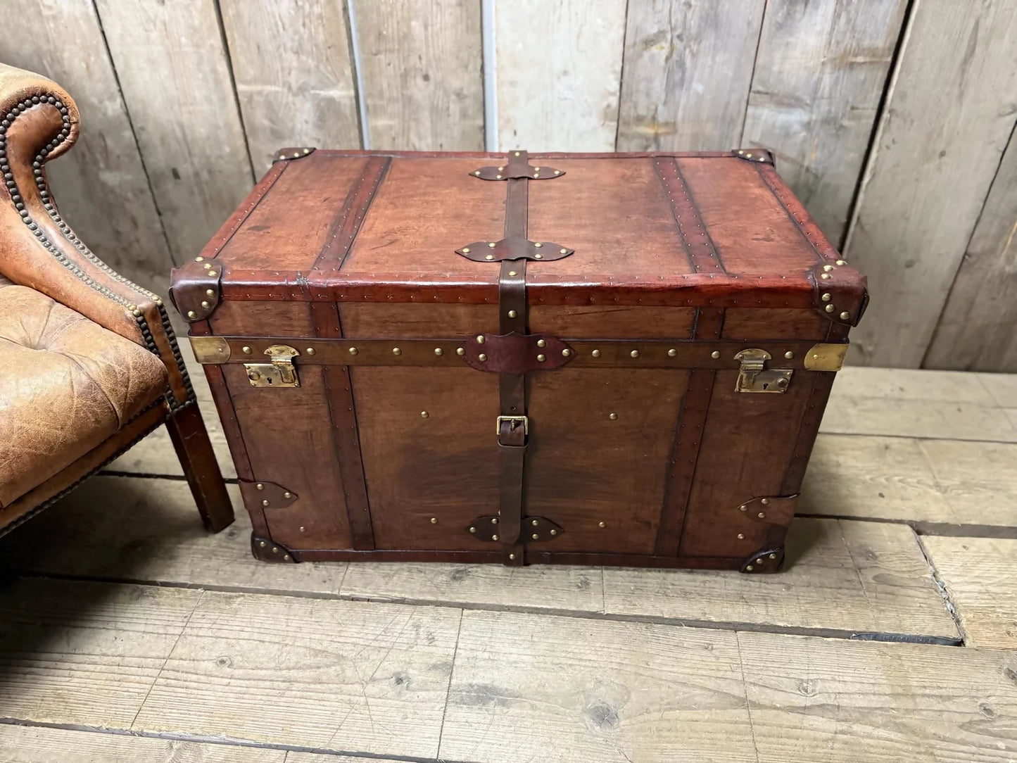 Antique leather trimmed chestnut brown campaign chest