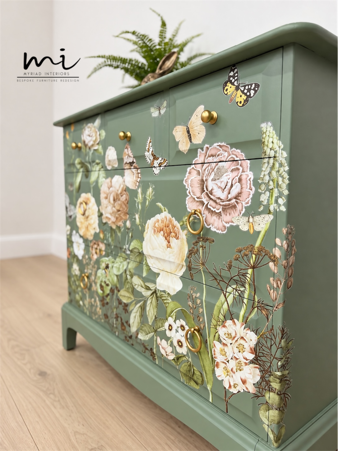 Sage green Stag Minstrel chest of drawers with neutral floral design. 3 over 2. Sideboard, dresser, bedside table