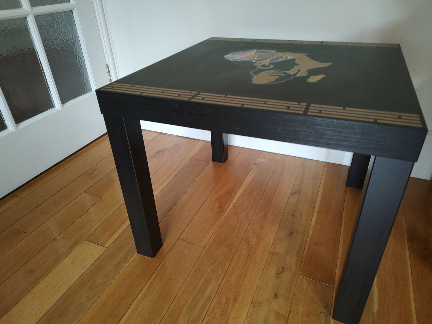 Black table with stunning African woman/map feature -Giving furniture a second life with soul