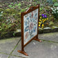 A RUPERT / NIGEL GRIFFITHS MONASTIC CARVED OAK FIRE SCREEN / STAND