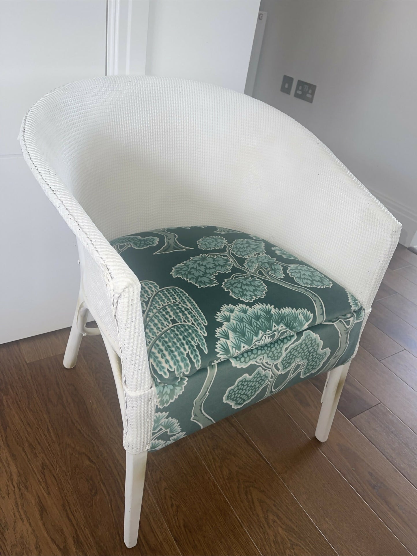 white accent chair with velvety tree pattern seat