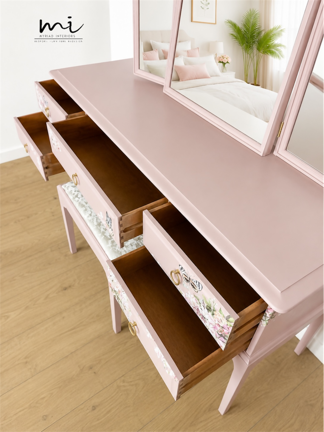 Dusky blush pink Stag Minstrel dressing table set with blossom and butterfly design.