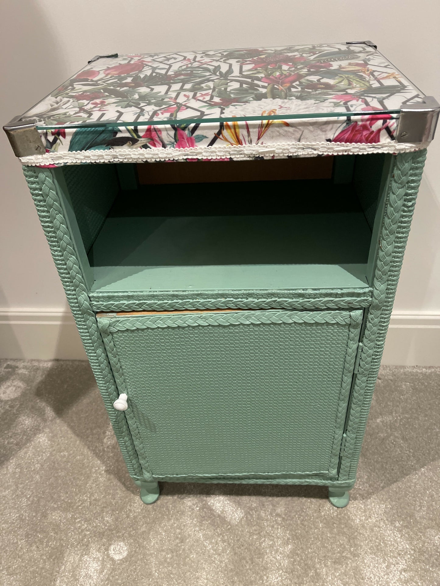 Green painted glass topped cabinet. Beautiful fabric accent top.