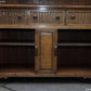 A RUPERT / NIGEL GRIFFITHS MONASTIC CARVED OAK DERBYSHIRE DRESSER / SIDEBOARD.