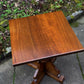 A RUPERT GRIFFITHS MONASTIC CARVED SOLID OAK LAMP TABLE / PLANT STAND