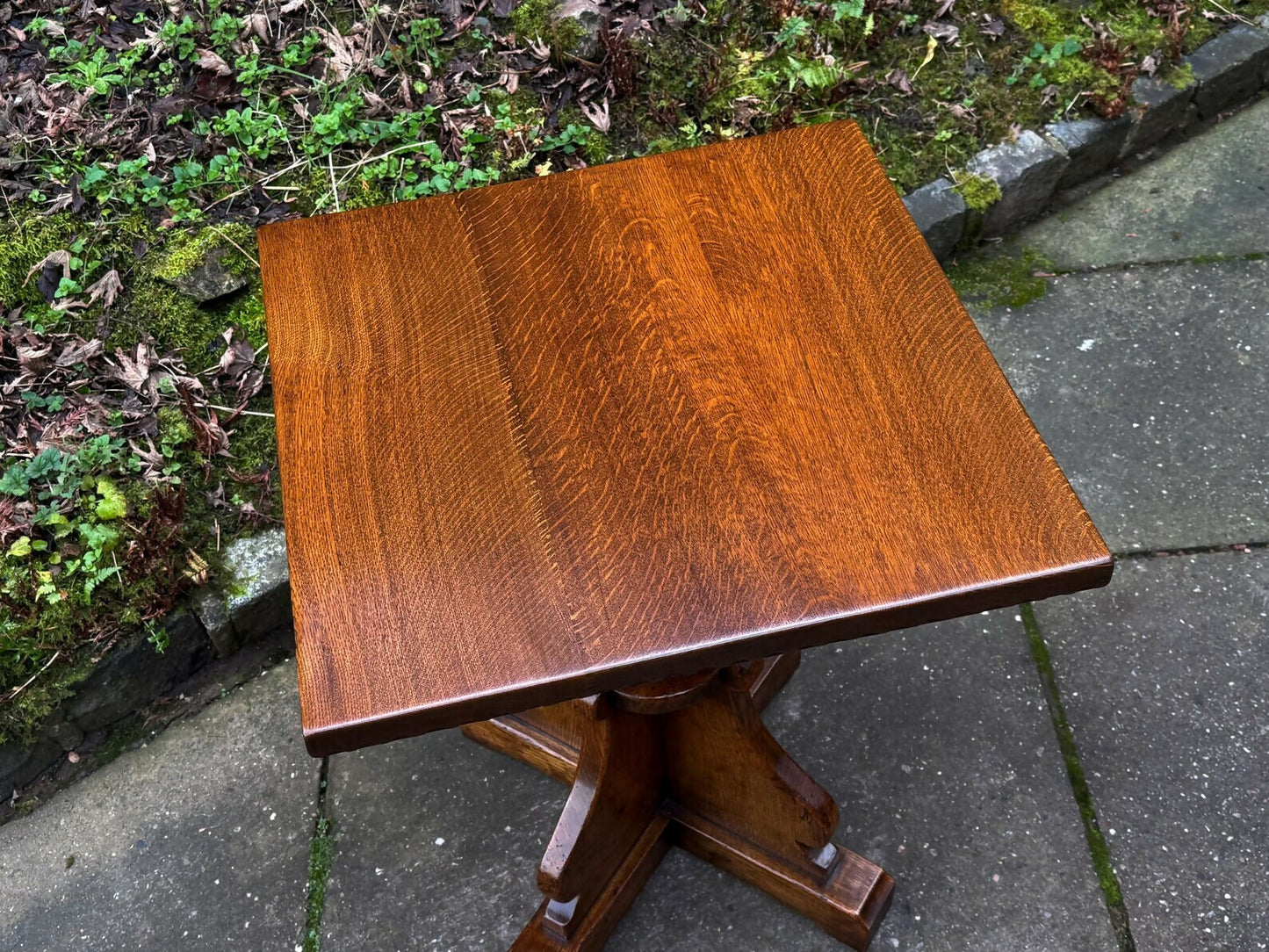 A RUPERT GRIFFITHS MONASTIC CARVED SOLID OAK LAMP TABLE / PLANT STAND