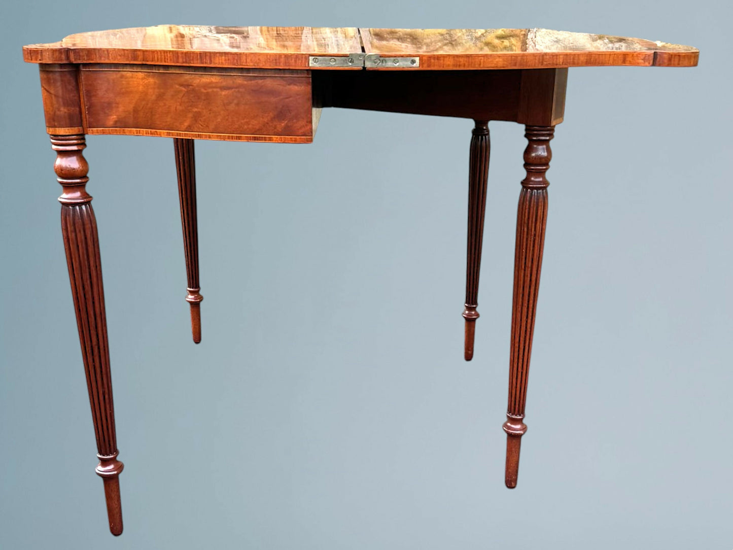 A Mahogany Serpentine Fronted Turn Over Top Tea Table