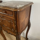 A near pair of antique French walnut and marble bedside tables
