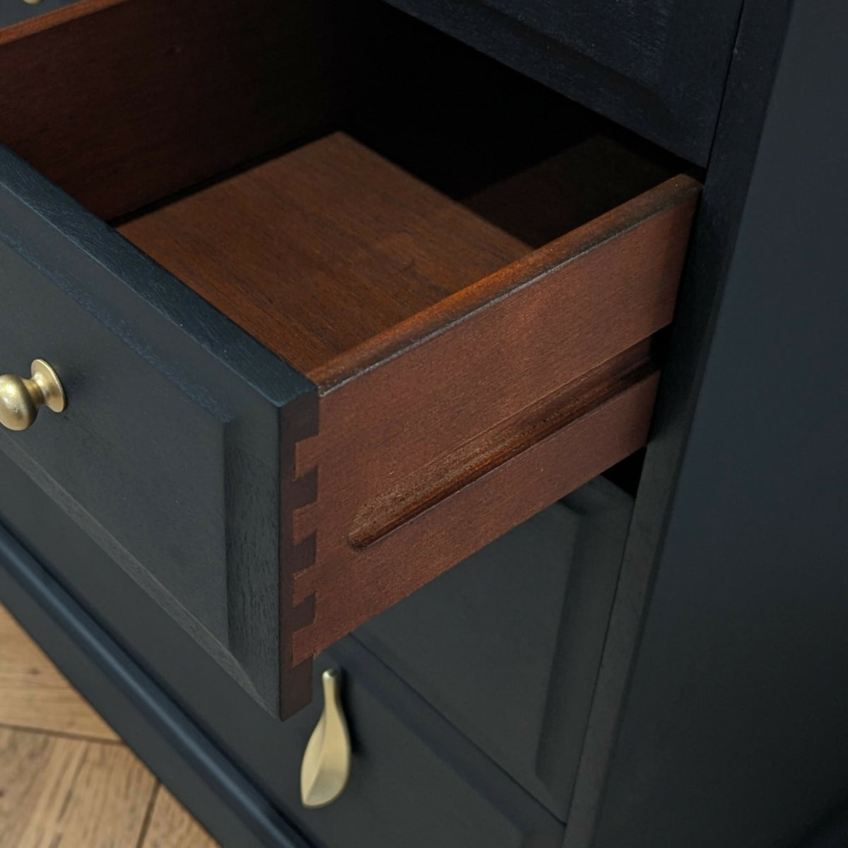 Stag minstrel black chest of drawers vintage tallboy with exposed wood top