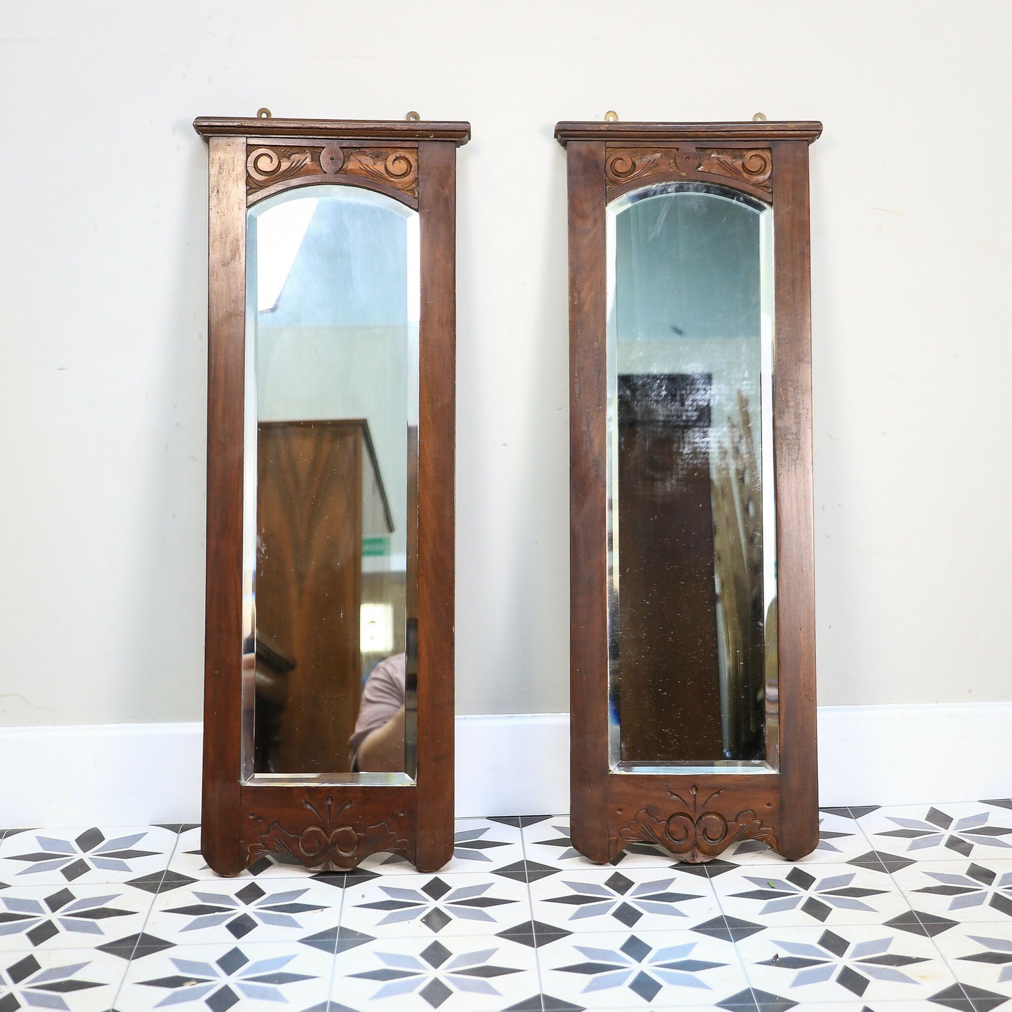 A Pair of Victorian Wall Mirrors Bevel Edged Glass Carved Top and Bottom