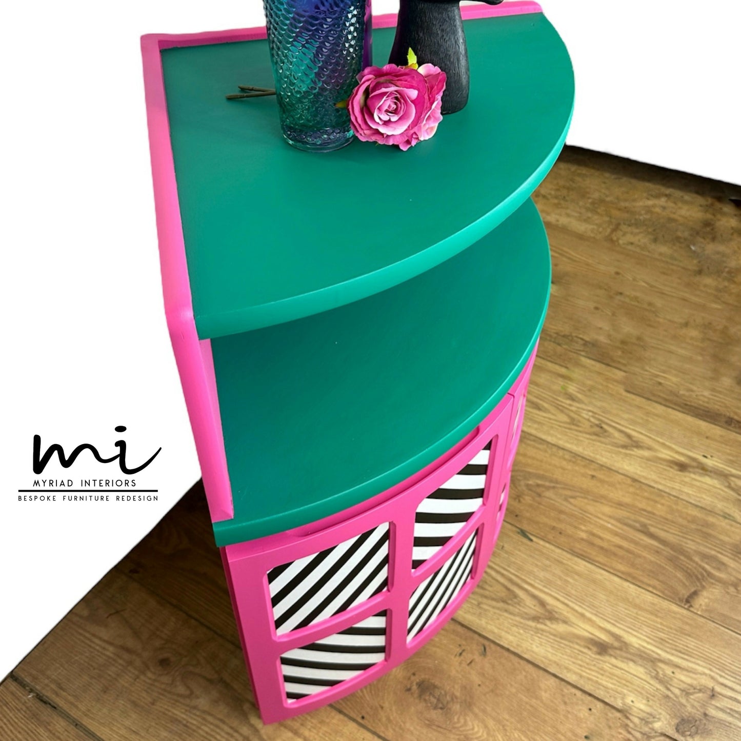 Maximalist hot pink and turquoise Nathan corner cabinet with black and white geometric design, mid century modern, bold, bright, statement