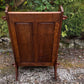 A NIGEL RUPERT GRIFFITHS MONASTIC CARVED OAK LEATHER FIRESIDE CHAIR / ARMCHAIR