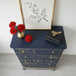 Nay and gold stag minstrel tall boy chest of drawers