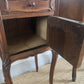 A near pair of antique French walnut and marble bedside tables