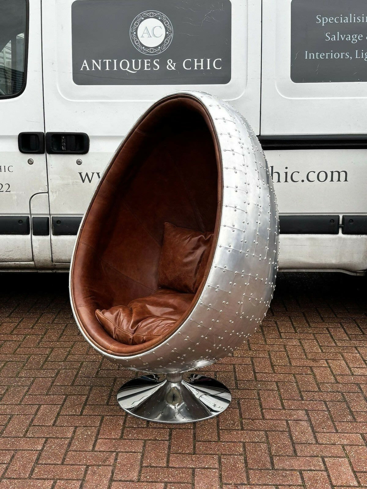Aviation Swivel Egg Chair With Tan Leather.