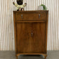 Vintage Art Deco burr walnut veneer cupboard featuring two doors and one drawer.
