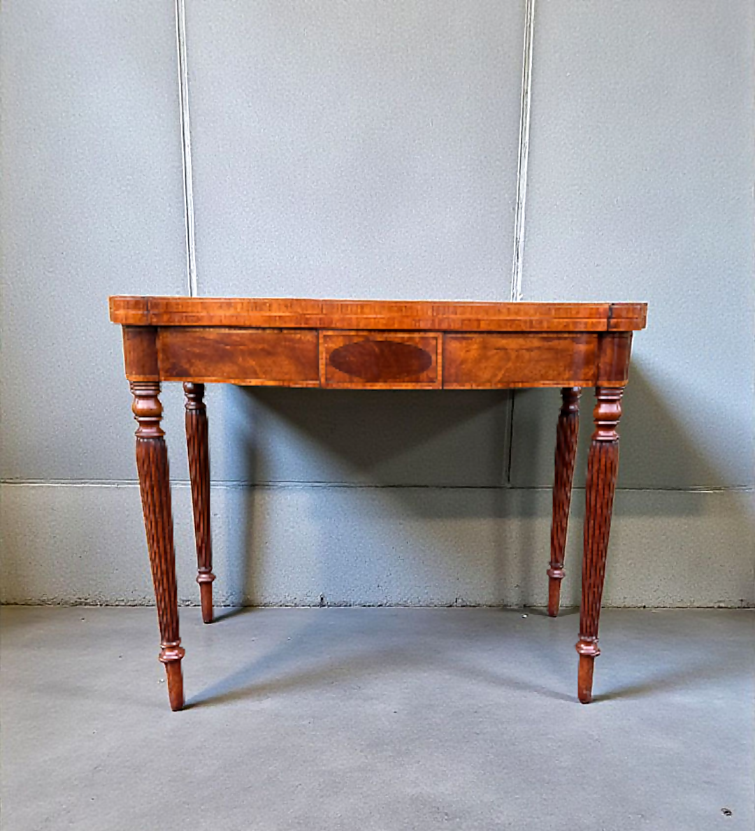 A Mahogany Serpentine Fronted Turn Over Top Tea Table